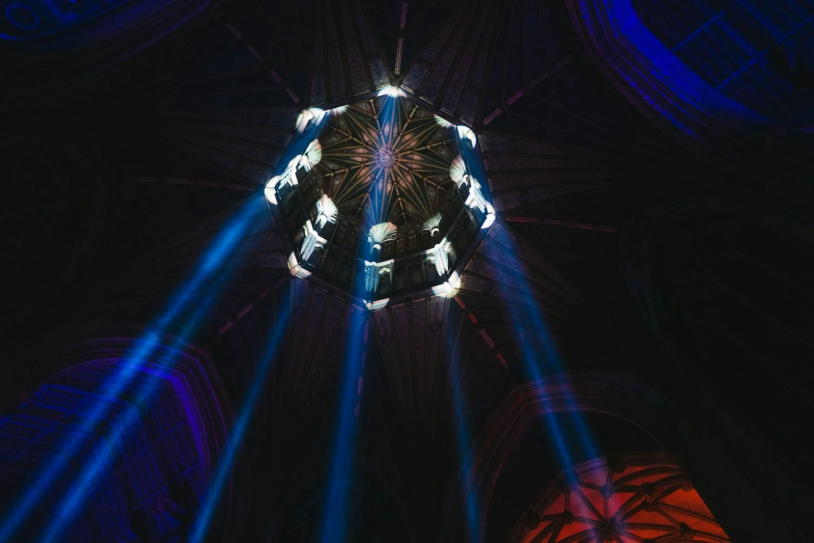 a view of the ceiling of a building with lights on it a view of the ceiling of a building with lights on it